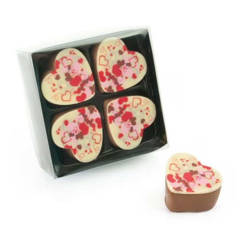 Klarsichtpackung mit 4 Nougat Herzpralinen
