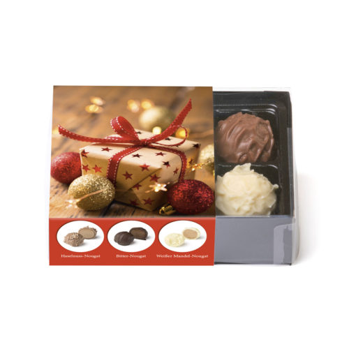 6 alkoholfreie Trüffel in einer Klarsichtpackung mit weihnachtlicher Banderole