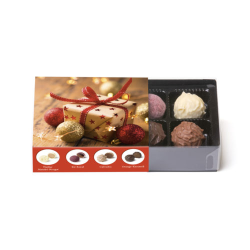 100g Trüffelmischung in einer Klarsichtpackung mit weihnachtlicher Banderole