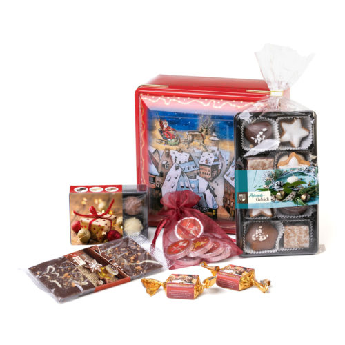 Süße Präsentdose mit weihnachtlichem Motiv und schokoladigem Inhalt