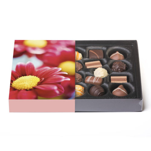 300g feinste Trüffel in einer Klarsichtpackung mit blumigen Banderole